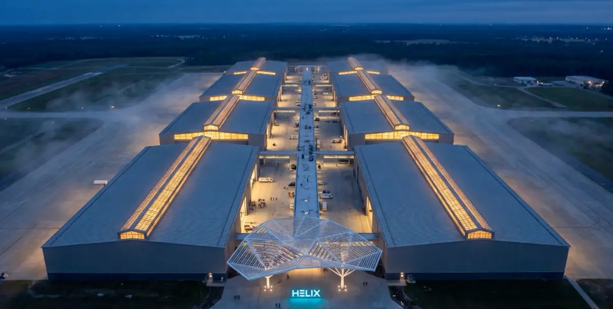 The HeliX flagship campus at dusk, halls flanking the central logistics spine